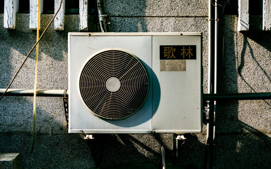 a wall mounted air conditioner mounted on the side of a building