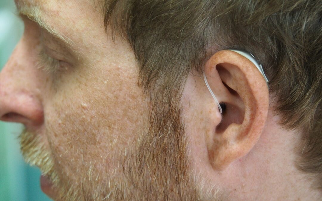 a close up of a man with ear buds on his ears